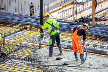 Concrete pouring on the construction site.