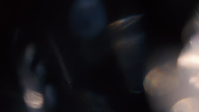 Prism Light Flares. Slow Motion of Chromatic Bokeh