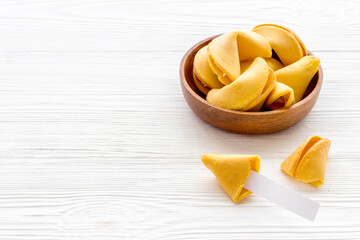 Many Chinese New Year fortune cookies in bowl. Asian New Year background