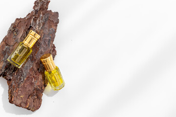 Arabian oud attar perfume essential oil in glass bottles, top view