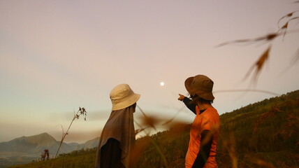 silhouette of women seeing full moon in the evening 2