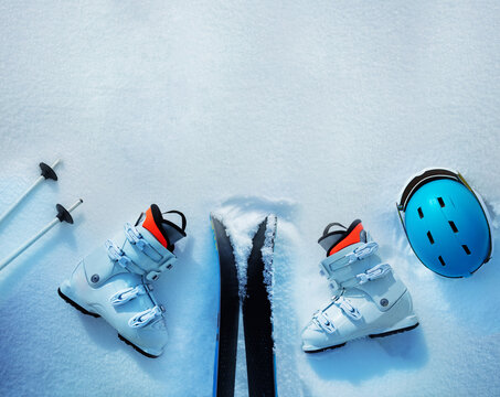 Many different things ski boots, helmets in snow from above