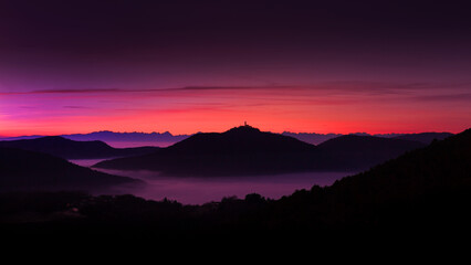 Dusk Panorama of Landscape of Mountains and Valleys covered under mist