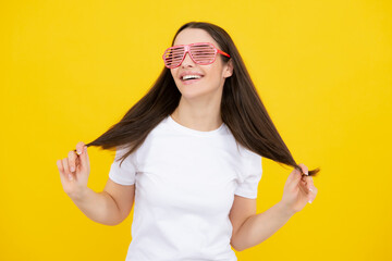 Portrait of a funny girl wearing cool party glasses.