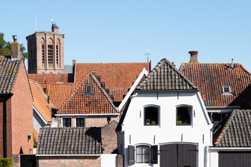 Roofs with red and black roof tiles of the medieval center of the Dutch Hanseatic city of Elburg.