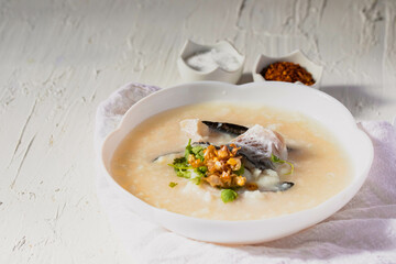 Fish porridge in a white bowl