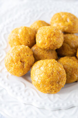 Cheesy Carrots Bites, White background, White plate, simple, clear
