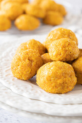 Cheesy Carrots Bites, White background, White plate, simple, clear
