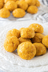 Cheesy Carrots Bites, White background, White plate, simple, clear
