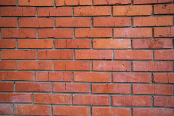 Background of red bricks. Elements of the facade of the building close-up.