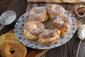 Plate with choux pastry and whipped cream filling