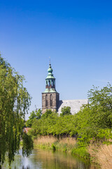 Historic church tower at the Vechte river in Nordhorn, Germany