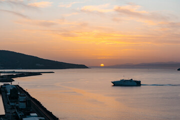 View of a ferry at sunset entering the port of Ceuta