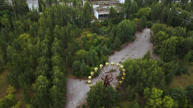 Aerial view of old abandoned Ferris wheel in the amusement park in the ghost town Pripyat Ukraine. Chernobyl nuclear power plant zone of alienation