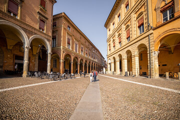 Fototapeta na wymiar Morning view on Seven churches square in old town of Bologna city. Ancient buildings with galleries in Emilia Romagna region in Italy
