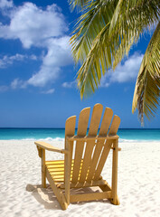 Yellow lounge chair on white sand beach