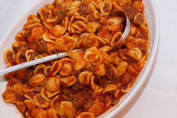 South italian pasta orecchiette with tomato sauce and minced meat ragu