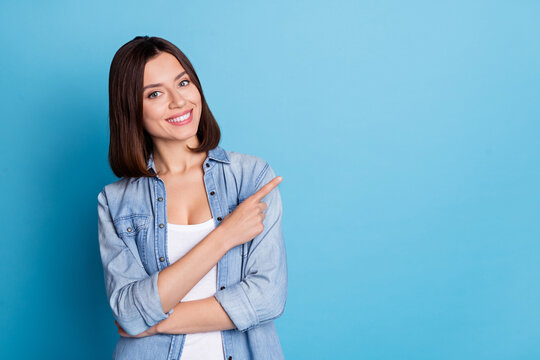 Portrait Of Positive Pretty Lady Indicate Finger Empty Space Promotion Isolated On Blue Color Background