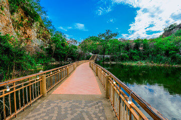 Close-up nature background The atmosphere is surrounded by (rivers, trees, large rocky mountains) and cool breezes at the viewpoint or tourist attraction.