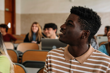 Young black student paying attention in class