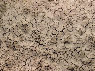 Fototapeta Dry river bed. Empty dry river bed with cracked ground. Global warming concept. Flat desert plain landscape, dried up reservoir, barren earth shattering obraz