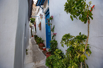 Fototapeta na wymiar Historical narrow street and colorful buildings of Plaka, old town, Athens, Greece