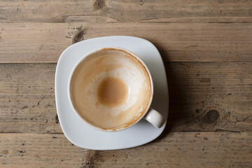 Empty coffee cup after drink on wood table