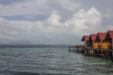 Borneo landscape. Bamboo huts on stilts above the water at Mabul island, Borneo, Sabah, Malaysia