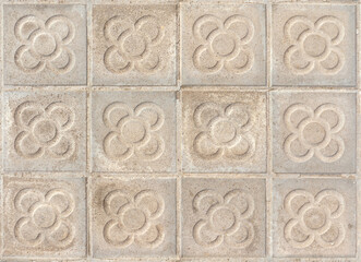 Barcelona pavement tiles with a flower, panot slabs with symbol  texture top view