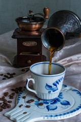 Сup of coffee with grinder