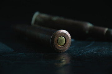 Old bullets with ammunition on a dark background close-up. The concept of modern armaments and wars