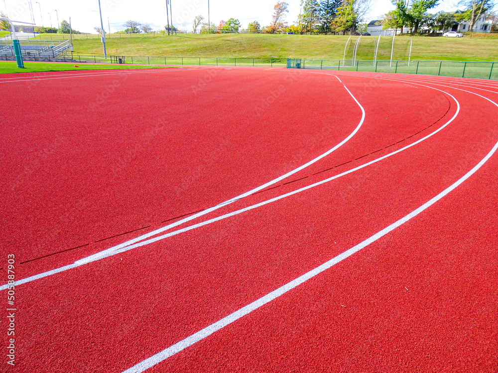 Wall mural Running track slot drain along radius, adjacent to steeplechase.