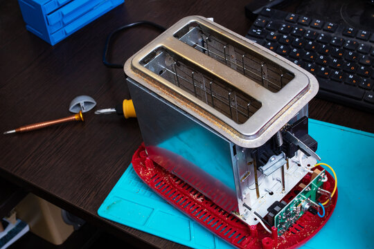 Parts of modern electric bread toster on the table