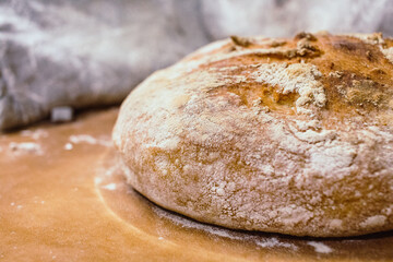 Crisp homemade bread on a brown baking sheet paper