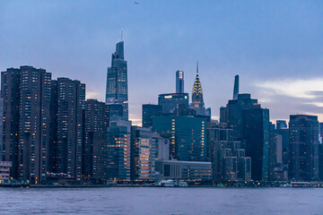 Midtown Manhattan skyline of New York City at twilight as seen from the east river