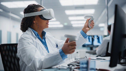 Futuristic Medical Hospital: Neurosurgeon Wearing Virtual Reality Headset Uses Controllers to...