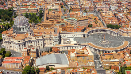 Aerial view of Papal Basilica of Saint Peter in the Vatican located in Rome, Italy. It is the most largest and important church of Catholicism in the world and the residence of the Pope. - obrazy, fototapety, plakaty