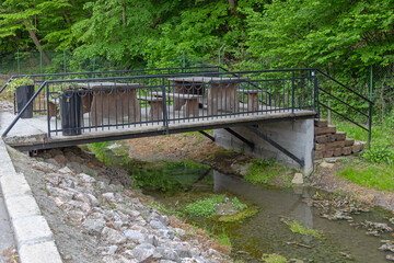 Fototapeta premium Picnic Tables Over Stream