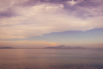 Fototapeta na wymiar Purple sunset over the calm sea. Aglicay, Romblon, Philippines