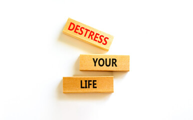 Destress your life symbol. Concept words Destress your life on wooden blocks. Beautiful white table white background. Psychological business and destress your life concept. Copy space.