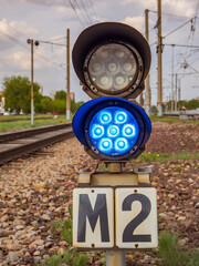 Two-section railway shunting semaphore with a colorlight signals. Blue light
