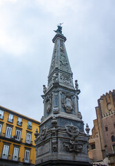Fototapeta na wymiar Obelisk of San Domenico on the Piazza San Domenico Maggiore in Naples