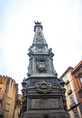 Fototapeta na wymiar Obelisk of San Domenico on the Piazza San Domenico Maggiore in Naples