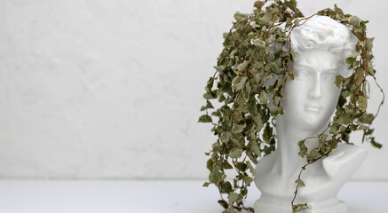 plant pot in the form of a male bust with ivy