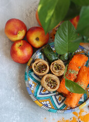 Baklava on blue decorative plate. Top view photo of delicious traditional sweets of Middle East. 