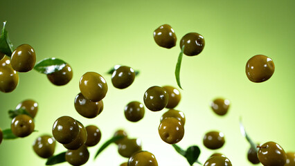 Freeze motion of flying green olives.