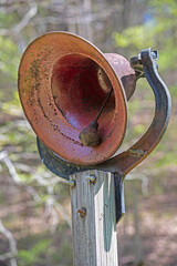 Old iron bell rings to get everyone's attention. - 505937195