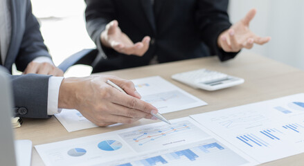 Brainstorm team, Marketers and financial accountants are discussing and analyzing charts to plan strategies to meet customer needs, Computer technology for business concept.