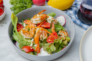 Shrimp Avocado Salad with Mixed Vegetables on White Table