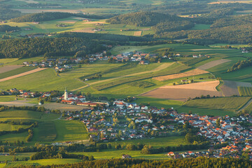 Fototapeta na wymiar View from mount Hohenbogen to Neukirchen Heiligblut, a small town in the Bavarian Forest.